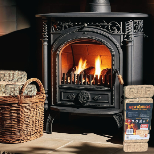 Decorative fireplace with lit logs, basket of firewood, and heating logs packaging.